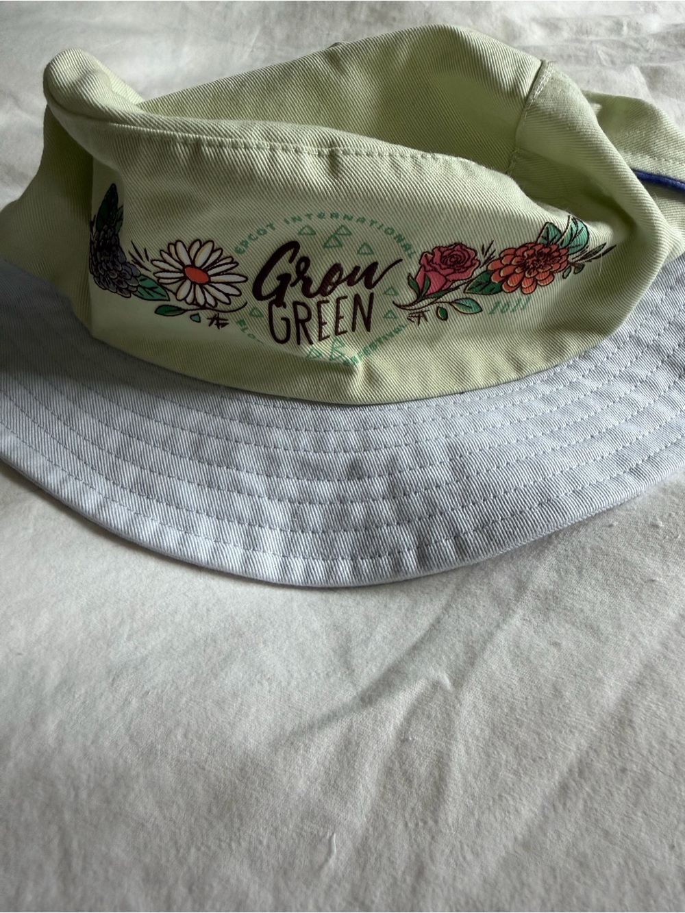 Epcot Flower and Garden Festive 2022 Bucket Hat Light Green and Light Blue